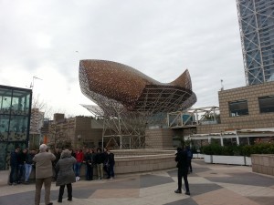A copper fish on top of a building